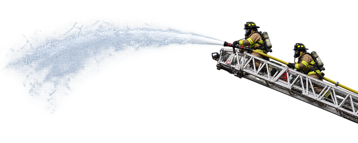 Firefighters spraying water from a fire truck ladder
